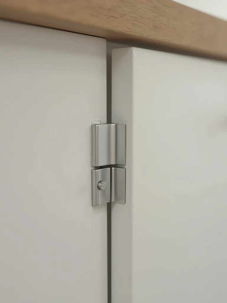 Close up of soft closing cabinet hinge.