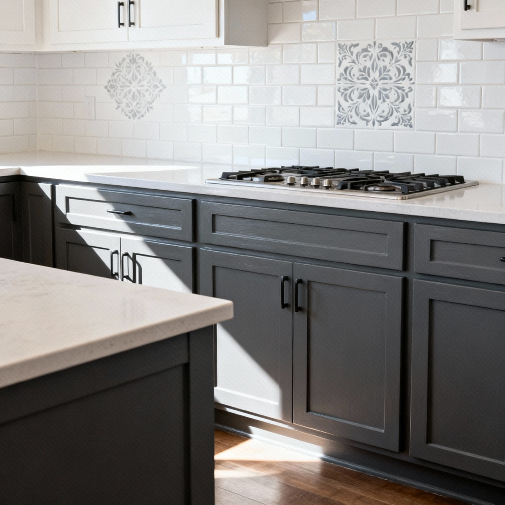 Freshly painted kitchen cabinets and an updated stenciled backsplash, showcasing a thoughtful paint application for renovated kitchen surfaces.