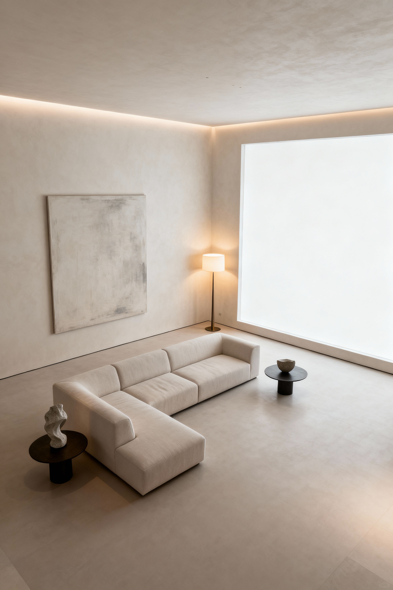 Minimalist luxury living room with expansive negative space, light neutral sofa, large abstract art, and subtle cove lighting.