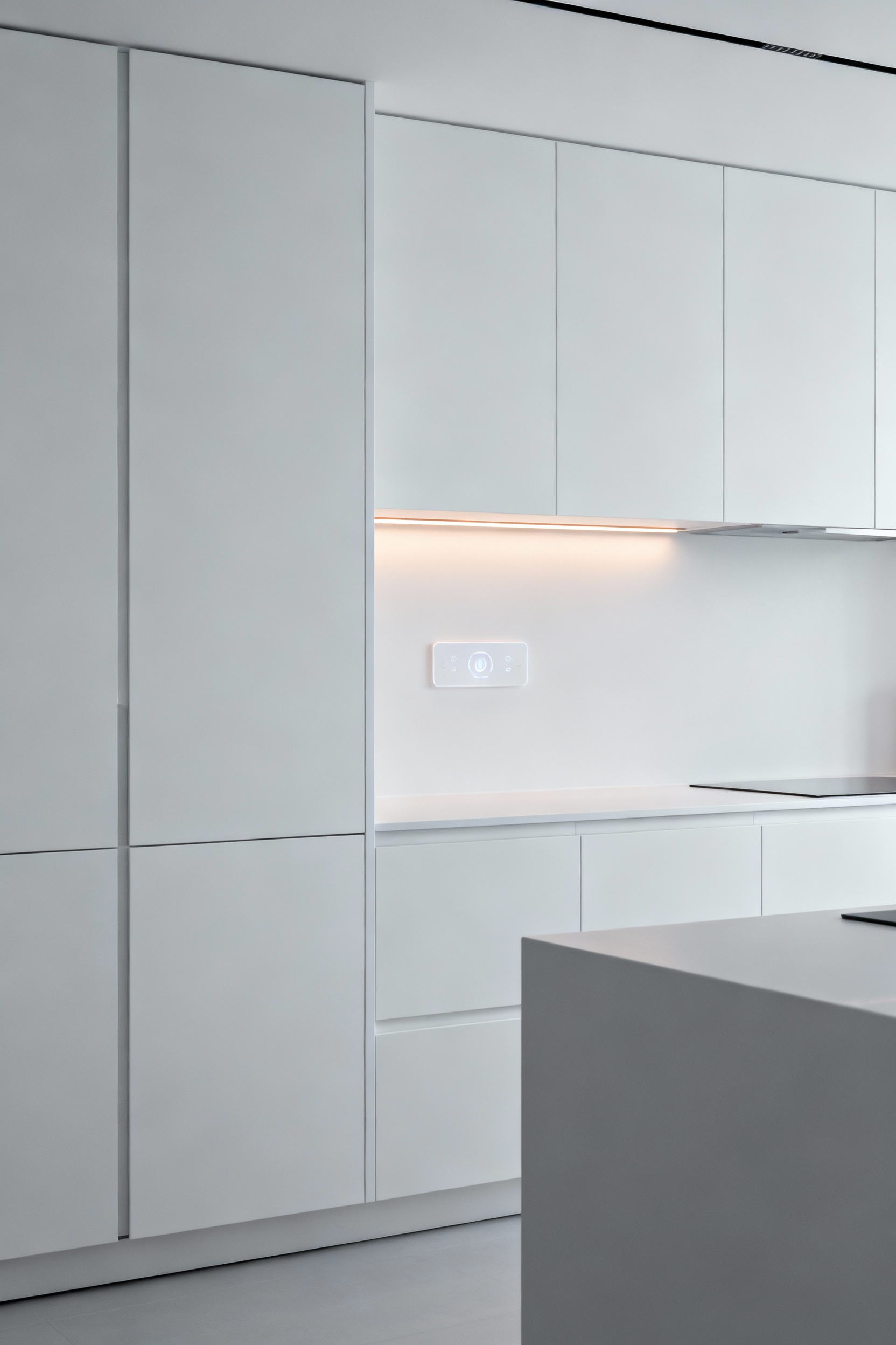 A sleek modern kitchen featuring flat-panel cabinet doors in a matte finish, emphasizing uninterrupted visual flow and the discreet integration of smart technology for a future-forward design.